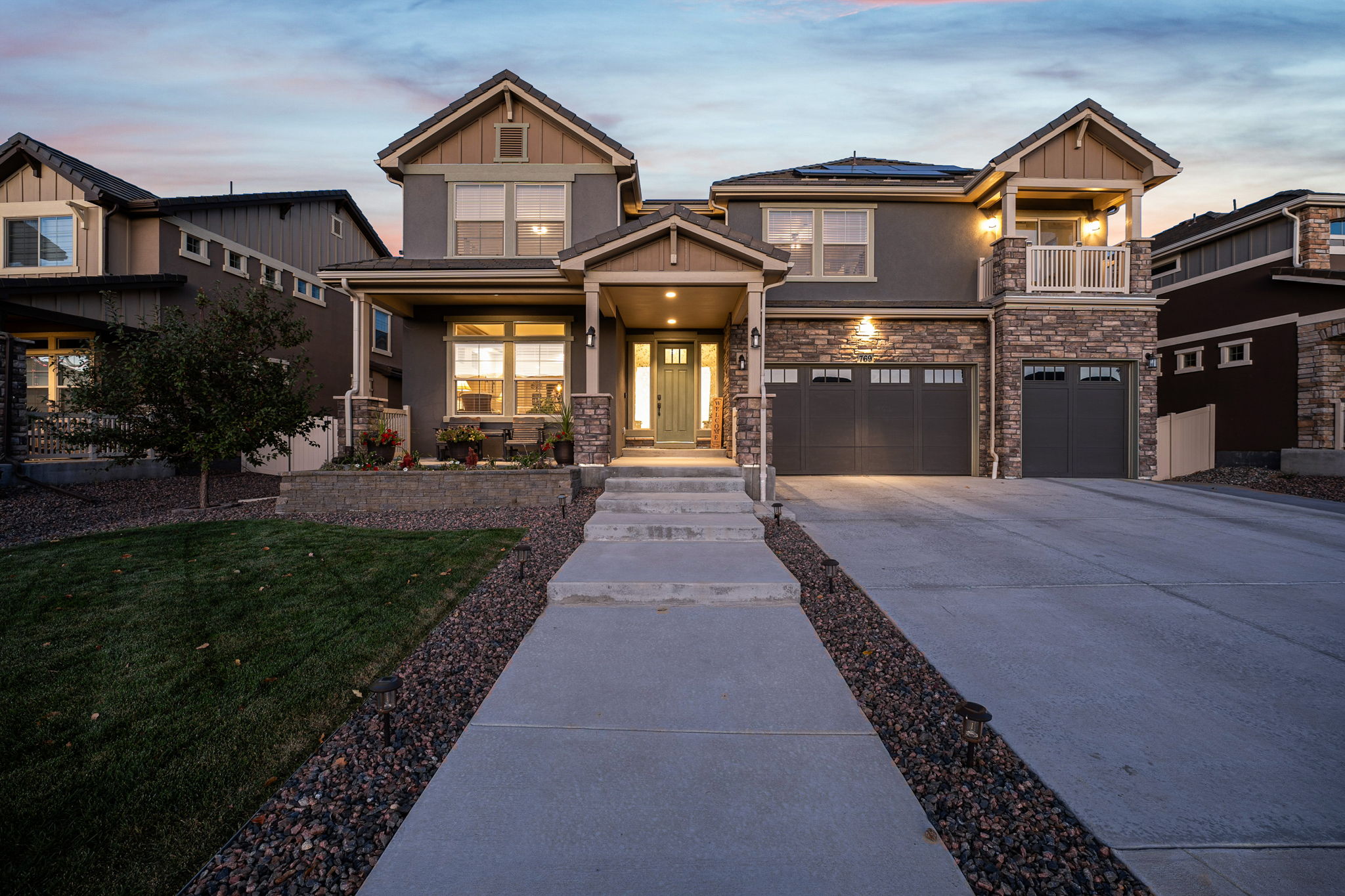 Front exterior of 769 Pagoda Ct in Erie Highlands with covered entry and landscaped walkway